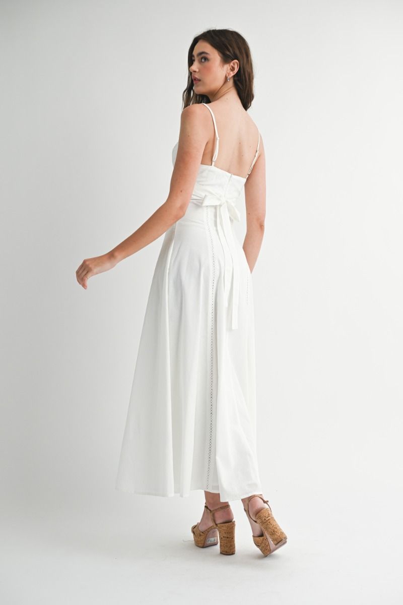 Solid adjustable spaghetti strap eyelet trim front cut out bustier fit and flare maxi dress with back self tie detail