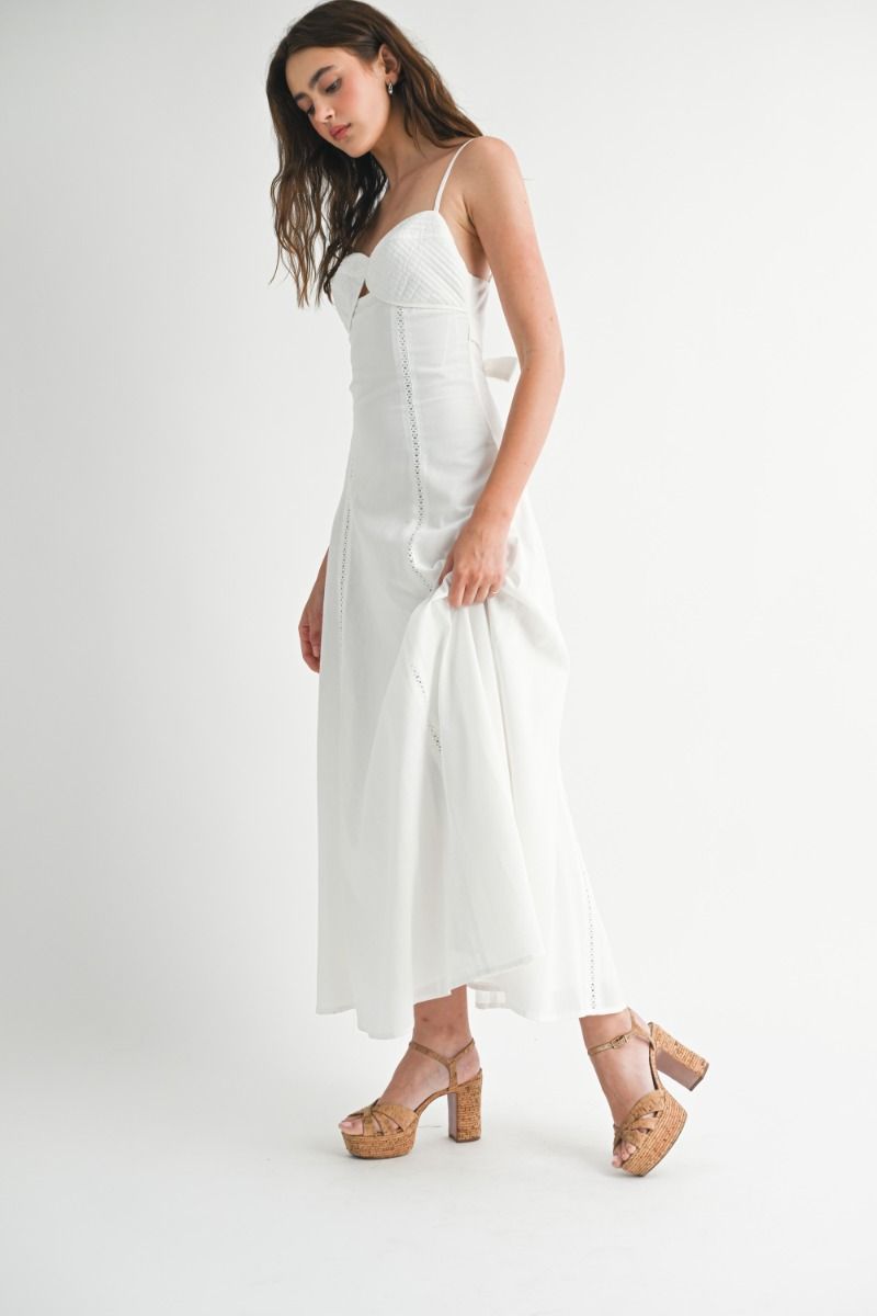 Solid adjustable spaghetti strap eyelet trim front cut out bustier fit and flare maxi dress with back self tie detail