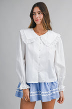 Solid long-sleeve blouse featuring an oversized sailor-style collar with scalloped eyelet lace trim