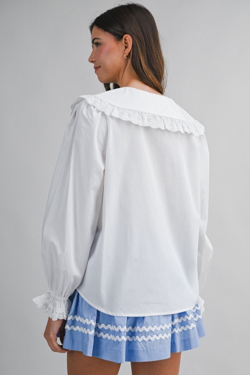 Solid long-sleeve blouse featuring an oversized sailor-style collar with scalloped eyelet lace trim