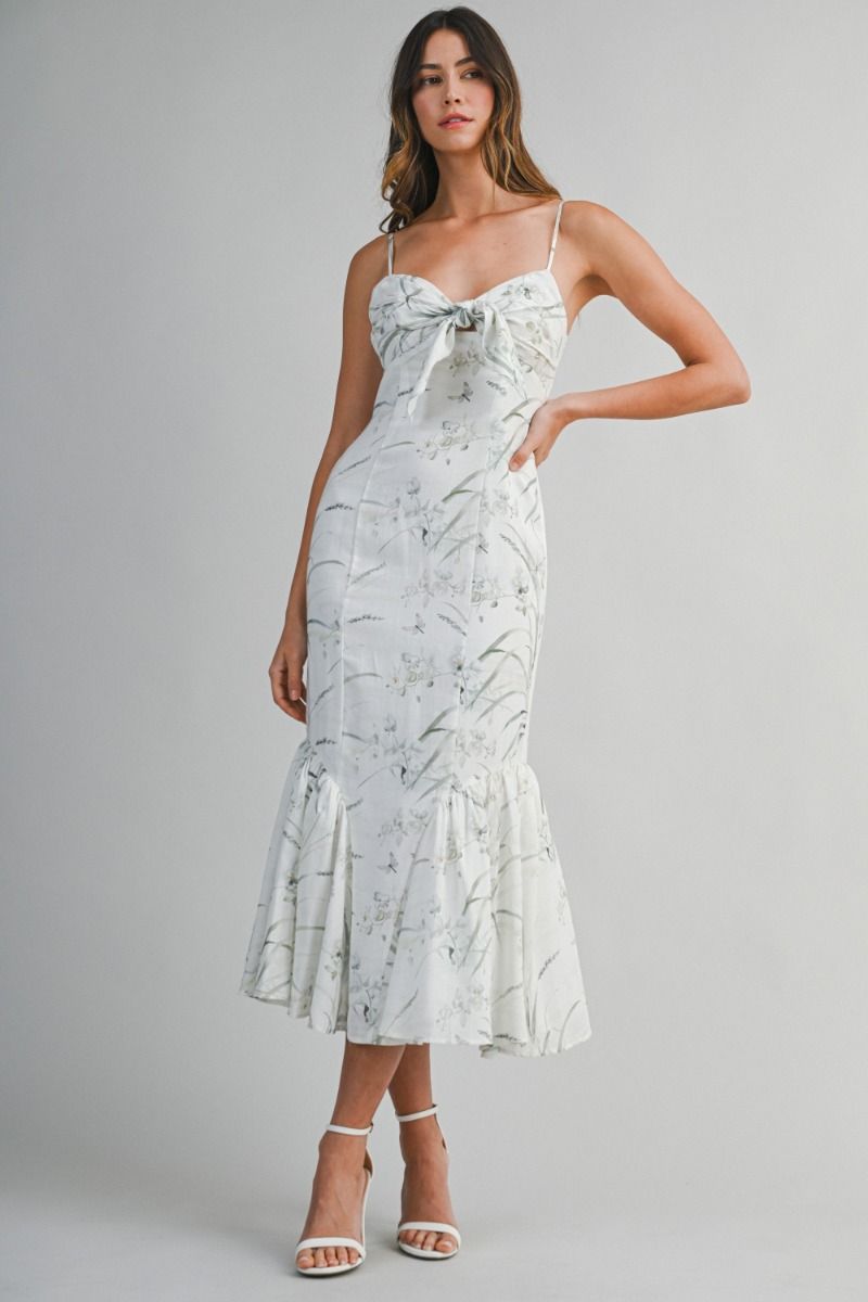 Woven midi dress featuring a sweetheart neckline with adjustable spaghetti straps.