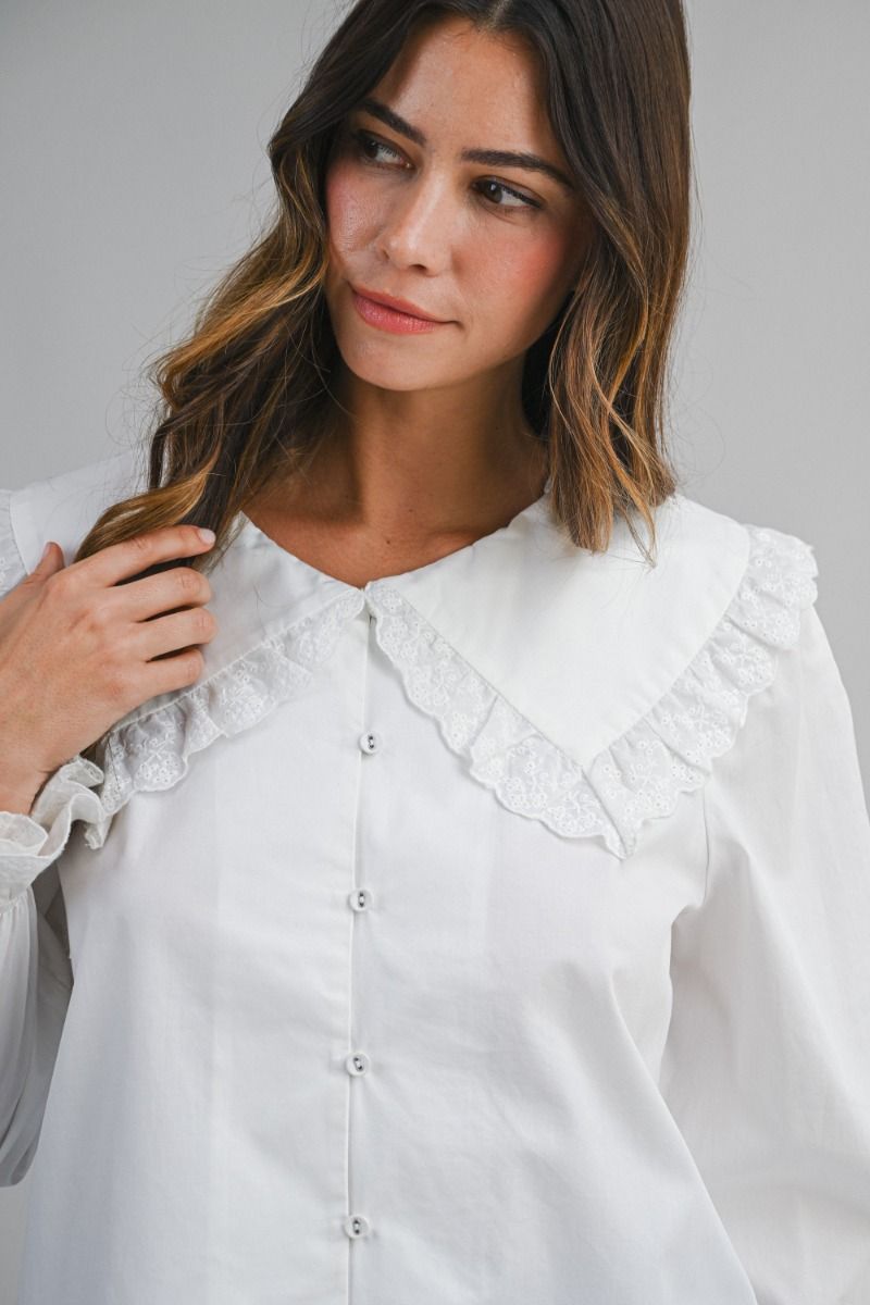 Solid long-sleeve blouse featuring an oversized sailor-style collar with scalloped eyelet lace trim
