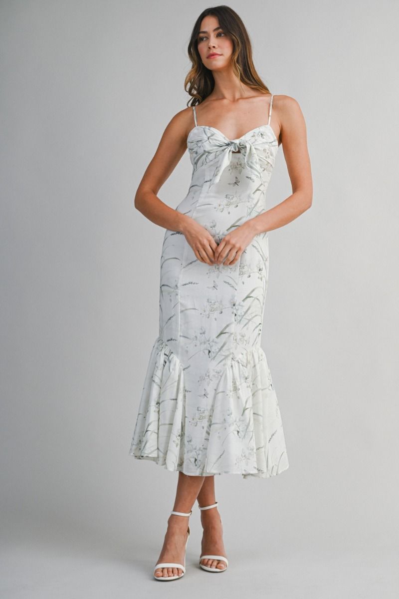 Woven midi dress featuring a sweetheart neckline with adjustable spaghetti straps.
