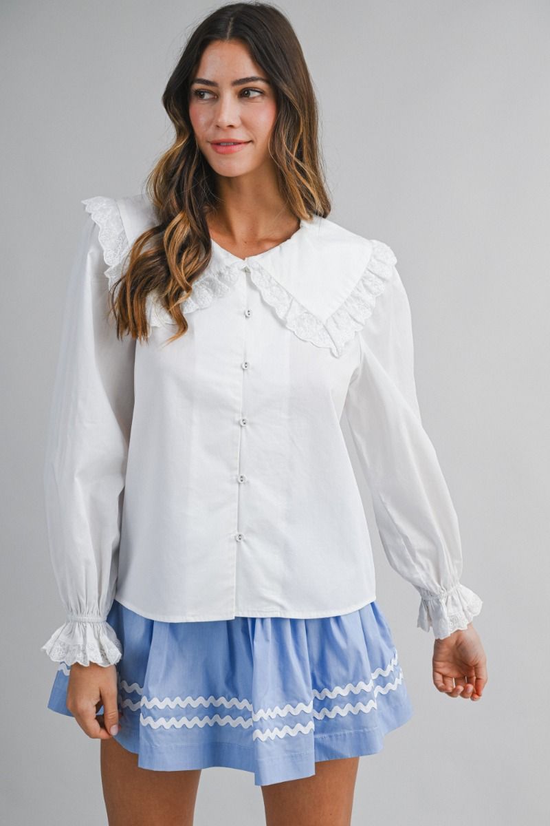 Solid long-sleeve blouse featuring an oversized sailor-style collar with scalloped eyelet lace trim
