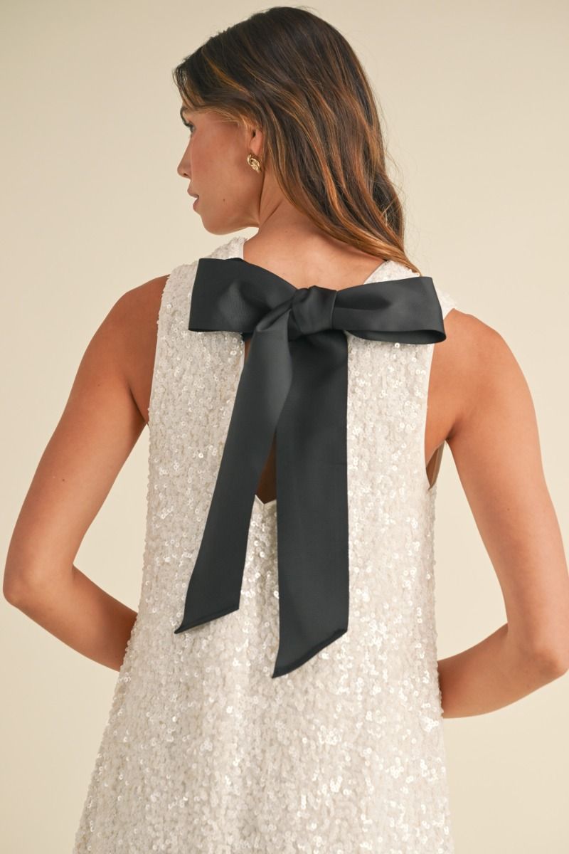 Sleeveless sequin shift mini dress with back satin tie detail