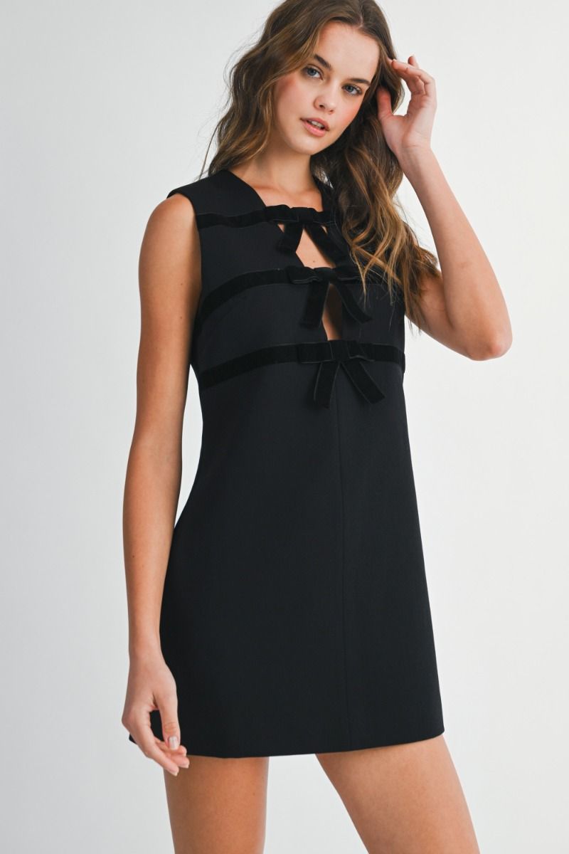 Sleeveless mini dress with round neckline and straight silhouette.