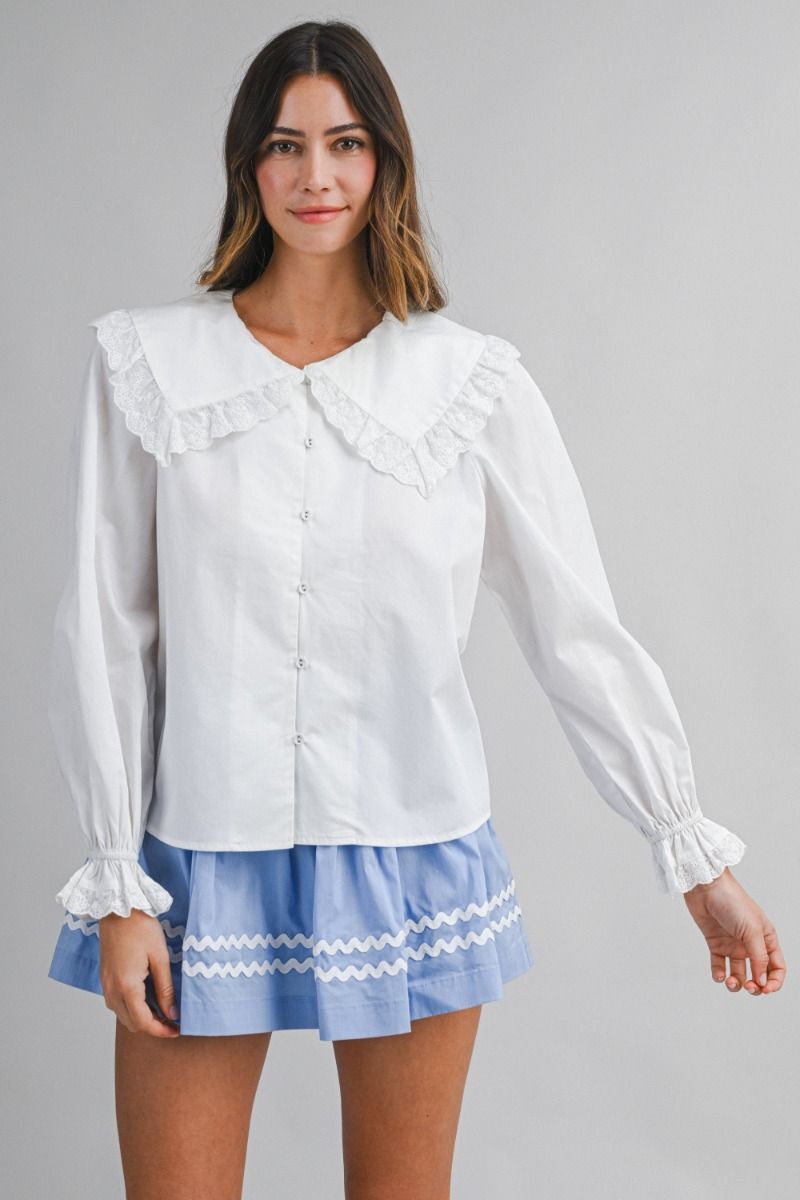 Solid long-sleeve blouse featuring an oversized sailor-style collar with scalloped eyelet lace trim