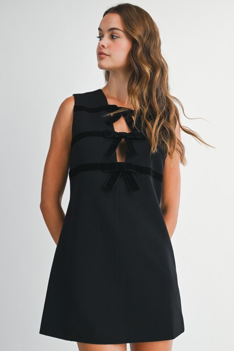 Sleeveless mini dress with round neckline and straight silhouette.
