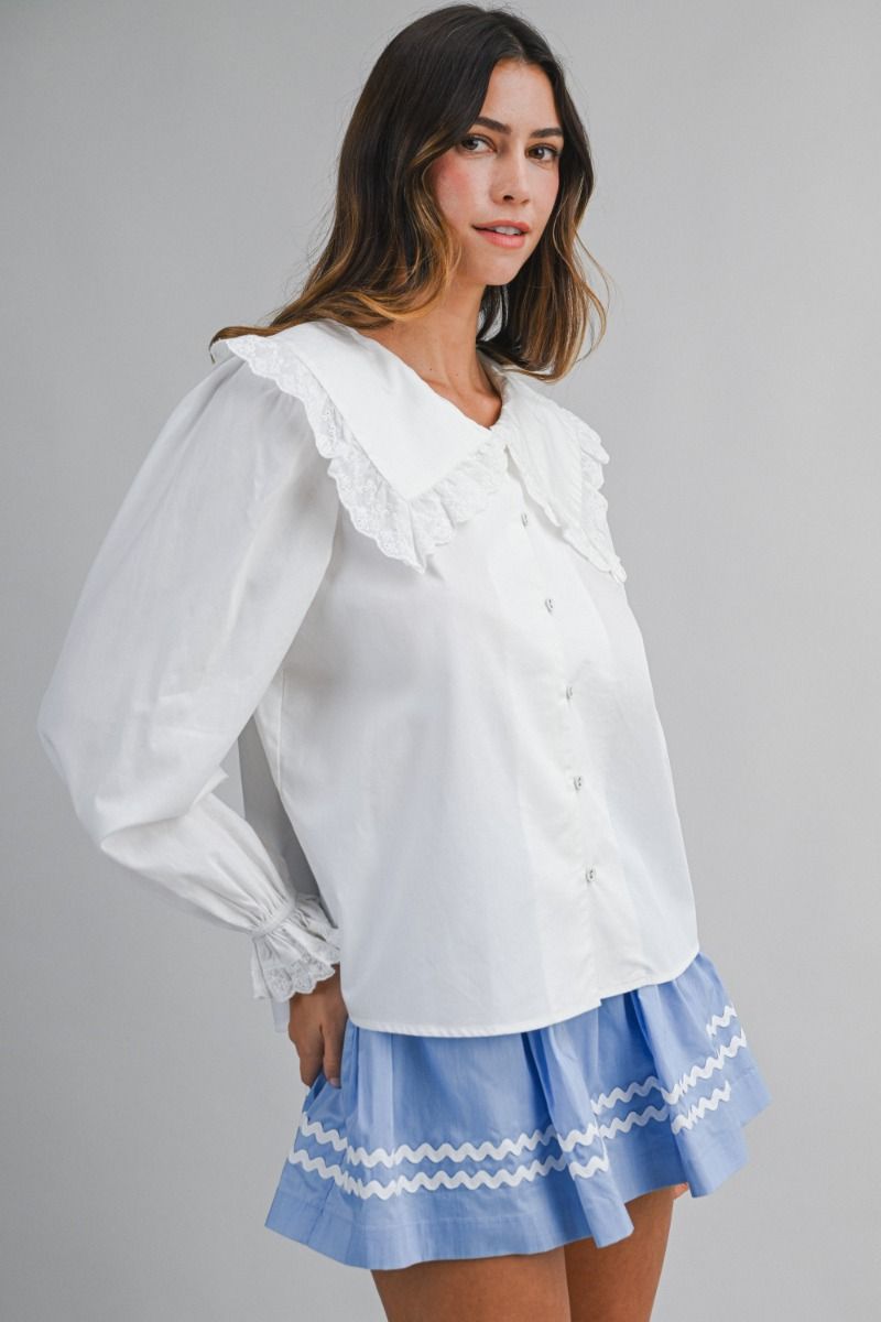Solid long-sleeve blouse featuring an oversized sailor-style collar with scalloped eyelet lace trim